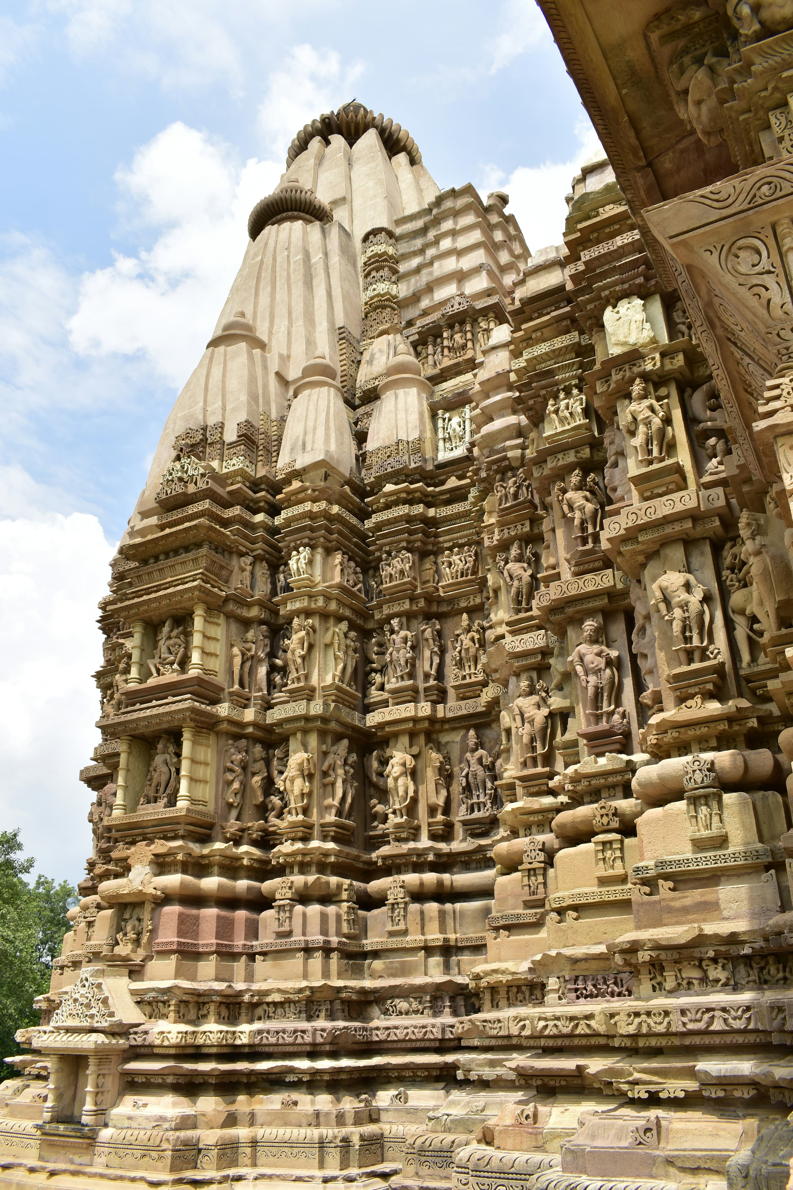 The sculpted Nagara-style shikhara of a Khajuraho temple