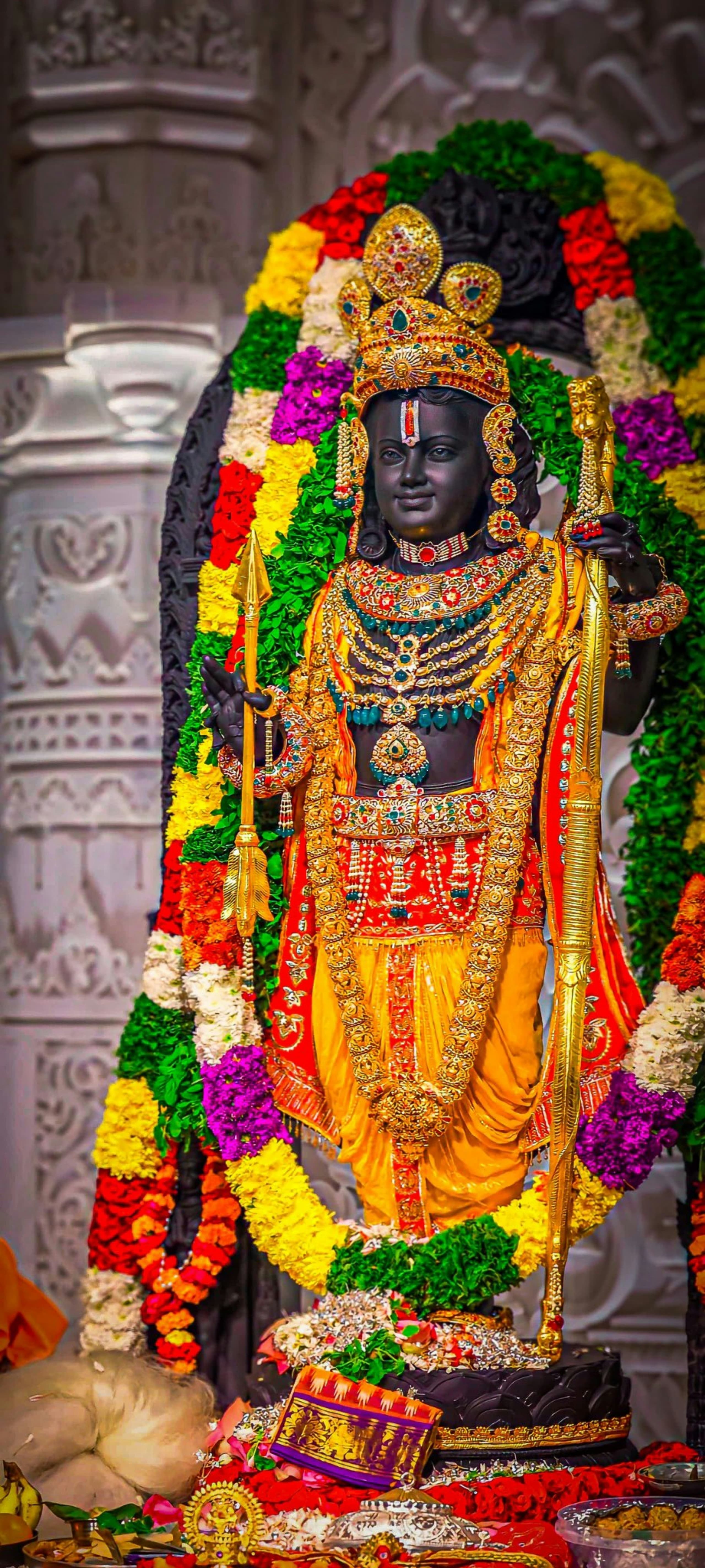 The consecrated idol of Ram Lalla, richly ornamented and framed by flower garlands